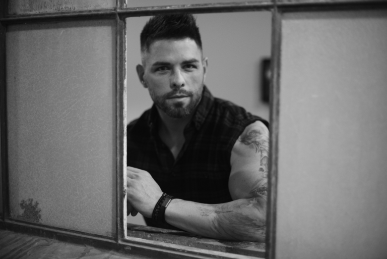 Jordan Moore Takes Listeners on a Country Rock Journey While Reminiscing on Rural Upbringing in “Backwoods Paradise” (Listen)